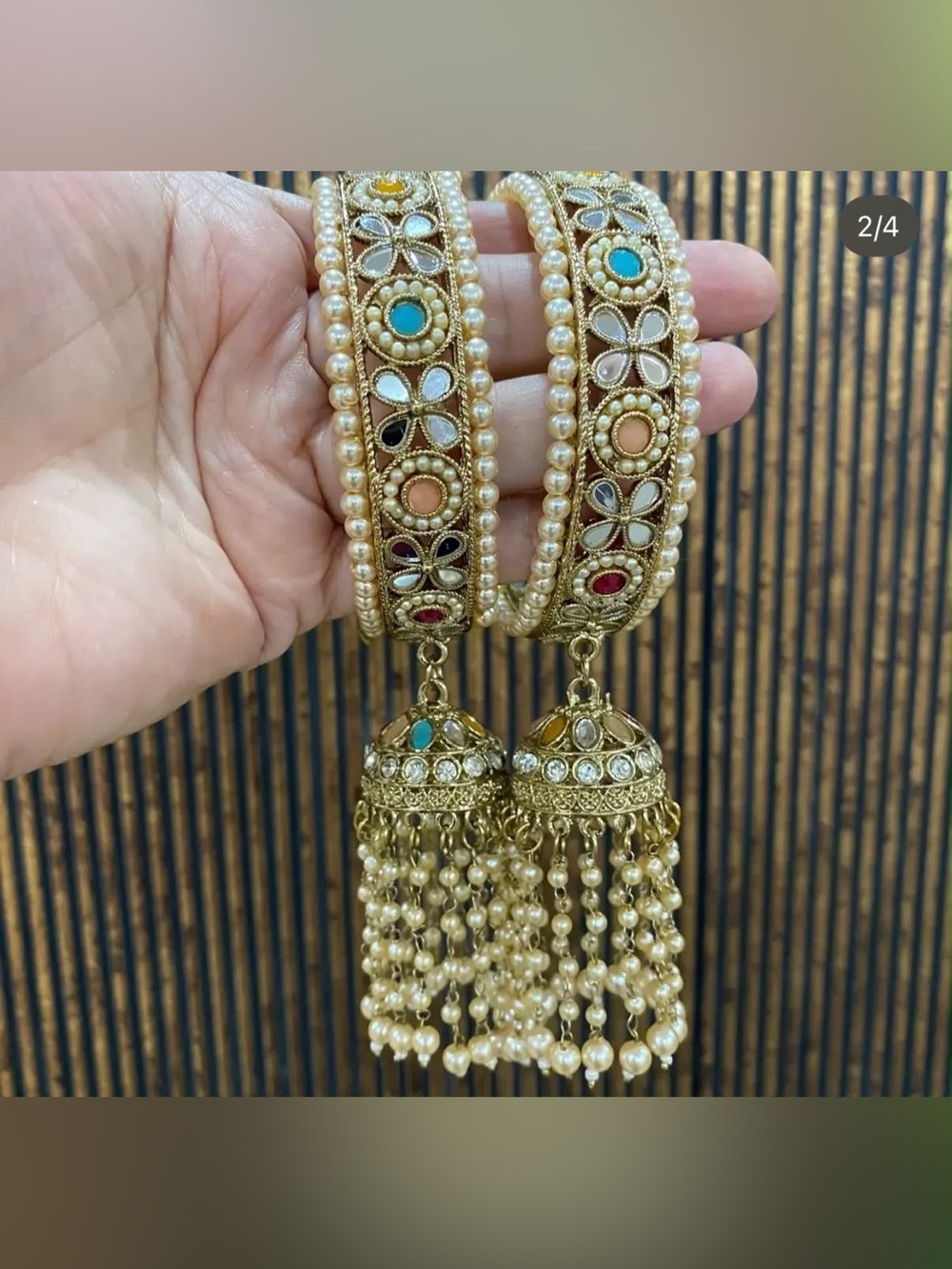 Gold Pearl Kundan Bracelet with Multicolor Accents and Jhumka Tassels